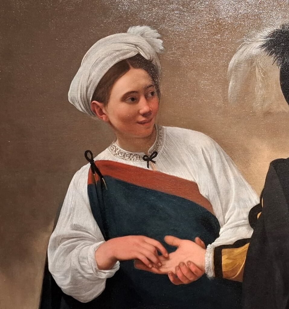 Dettaglio della gitana nella Buona Ventura di Caravaggio ai Musei Capitolini